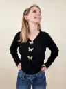 Gilet noir avec boutons papillons